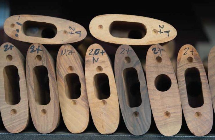 A stack of unused raw shotgun stocks.