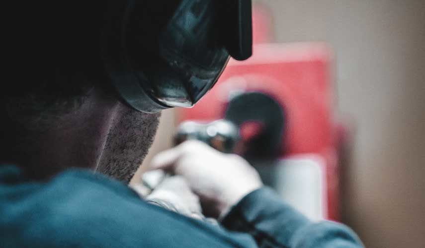 A gunmaker proofs a shotgun